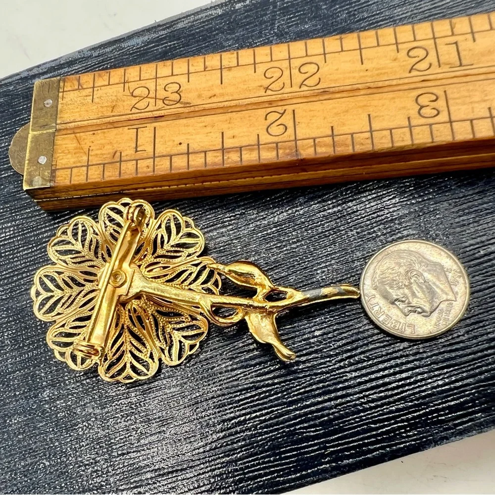 Vintage gold tone filigree flower brooch pin bright blue rhinestones